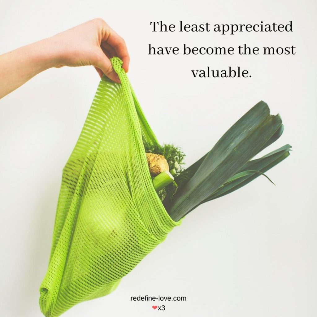 Clerk handing groceries. The least appreciated have become the most valuable.